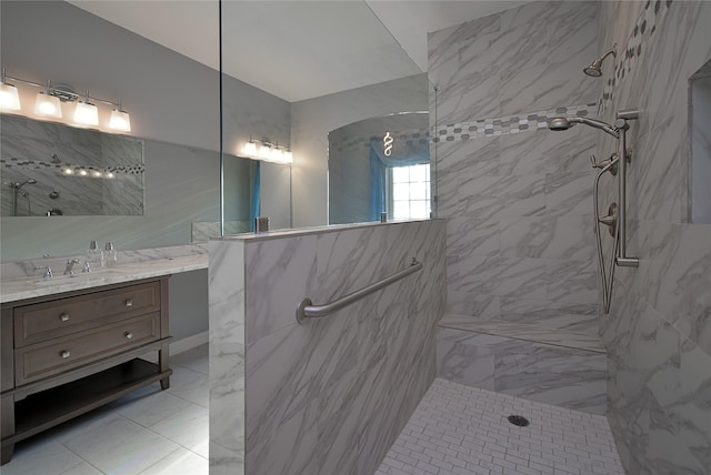 bathroom featuring vanity and a tile shower