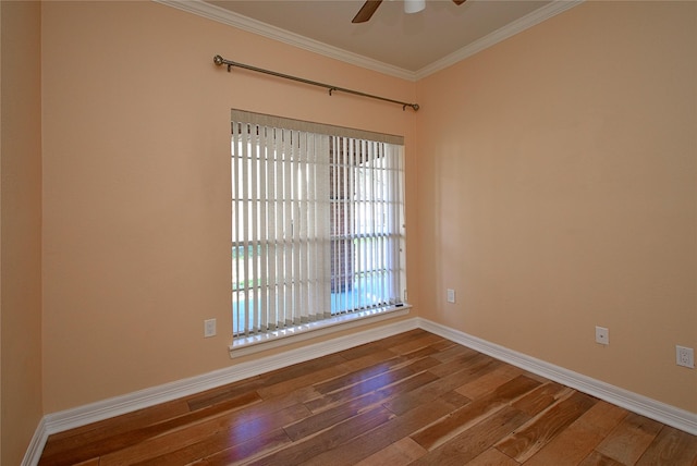 spare room featuring crown molding, ceiling fan, and hardwood / wood-style flooring