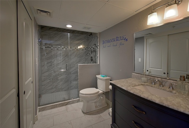 bathroom with vanity, toilet, and an enclosed shower