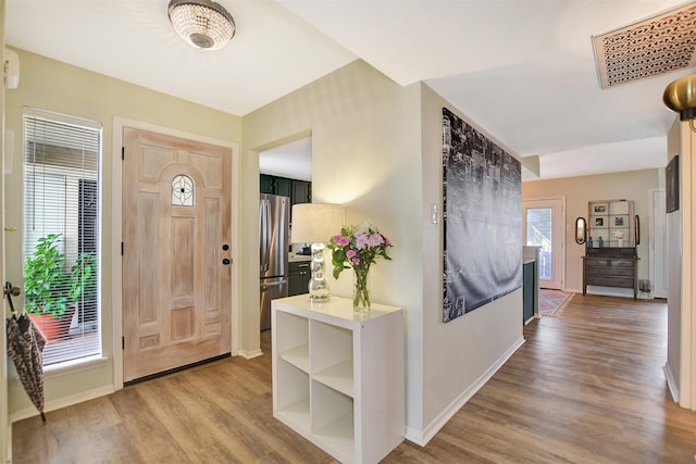 foyer entrance featuring hardwood / wood-style floors