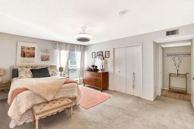 carpeted bedroom featuring a closet