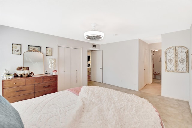 carpeted bedroom with ensuite bathroom