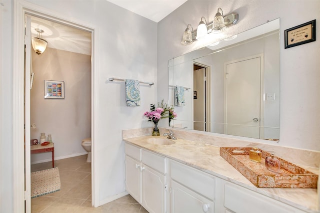 bathroom with tile patterned floors, toilet, and vanity