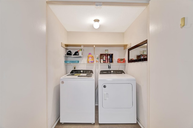 laundry area featuring light hardwood / wood-style floors and independent washer and dryer