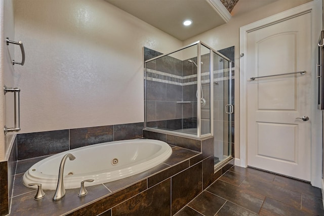 full bathroom with a jetted tub, a shower stall, and recessed lighting