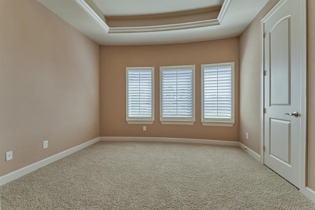 unfurnished room with carpet and baseboards