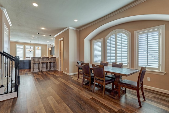 dining area with ornamental molding, recessed lighting, dark wood-style flooring, and baseboards