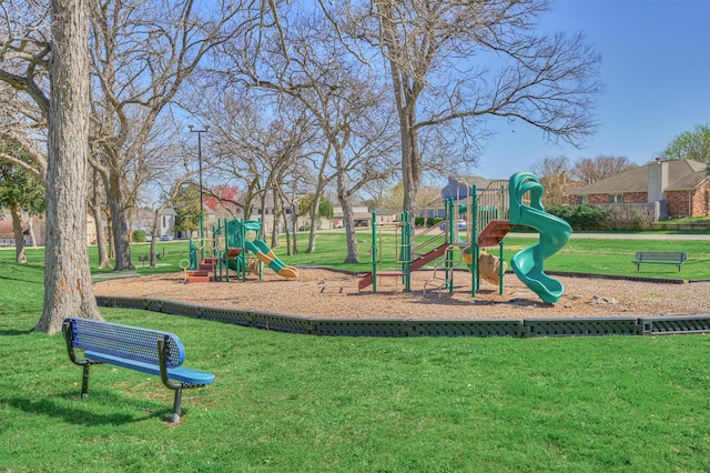 community jungle gym with a yard