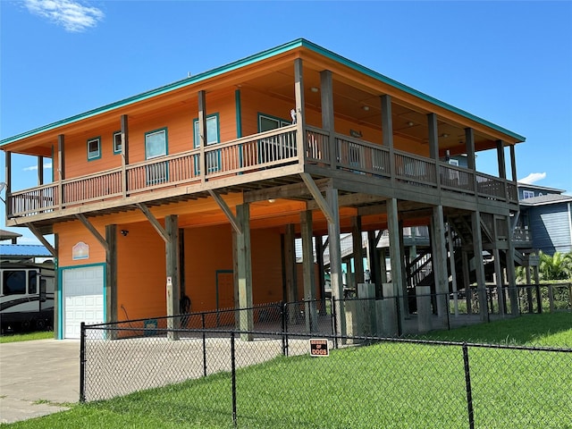 rear view of house with a yard