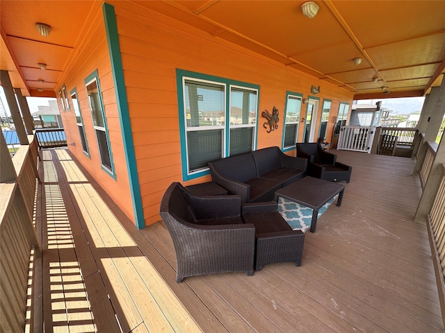 wooden terrace featuring an outdoor hangout area