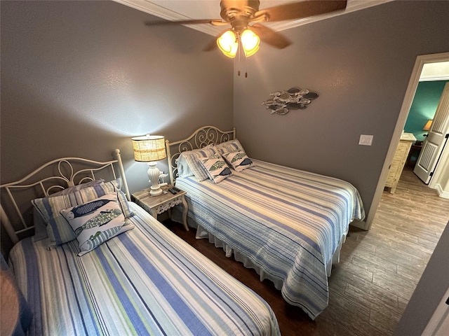 bedroom with hardwood / wood-style floors and ceiling fan