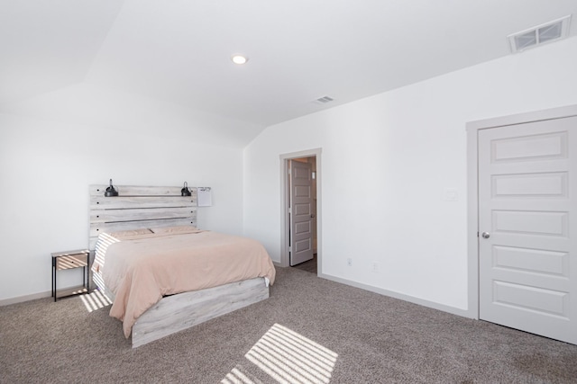 bedroom with lofted ceiling and carpet flooring