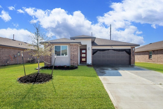 view of front of home featuring a garage and a front lawn