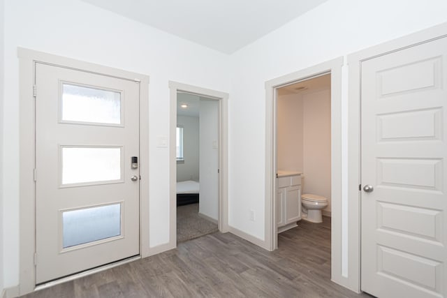 entryway with light hardwood / wood-style flooring