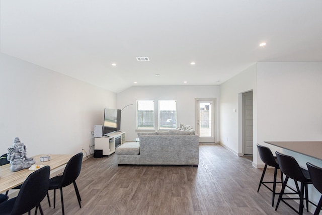 living room with lofted ceiling and hardwood / wood-style floors