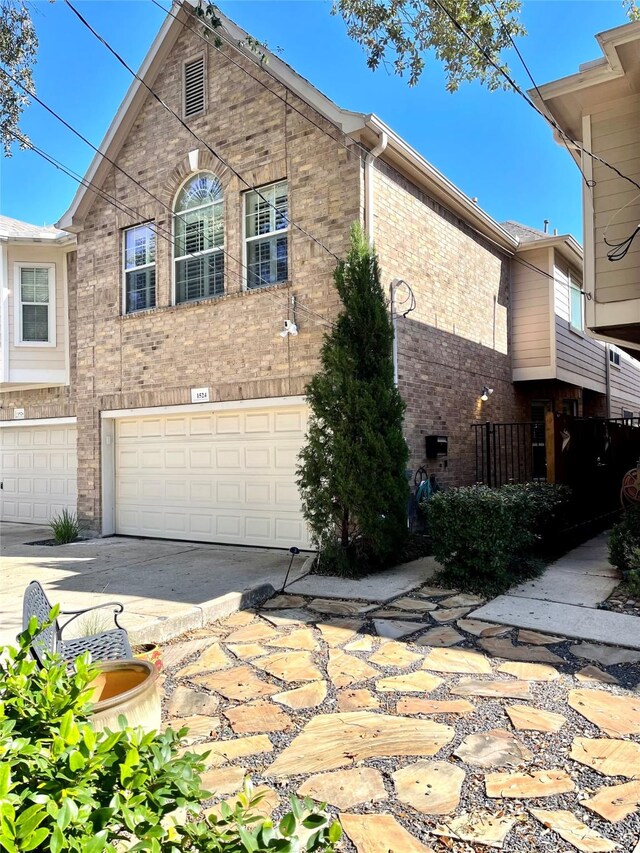 view of side of home with a garage