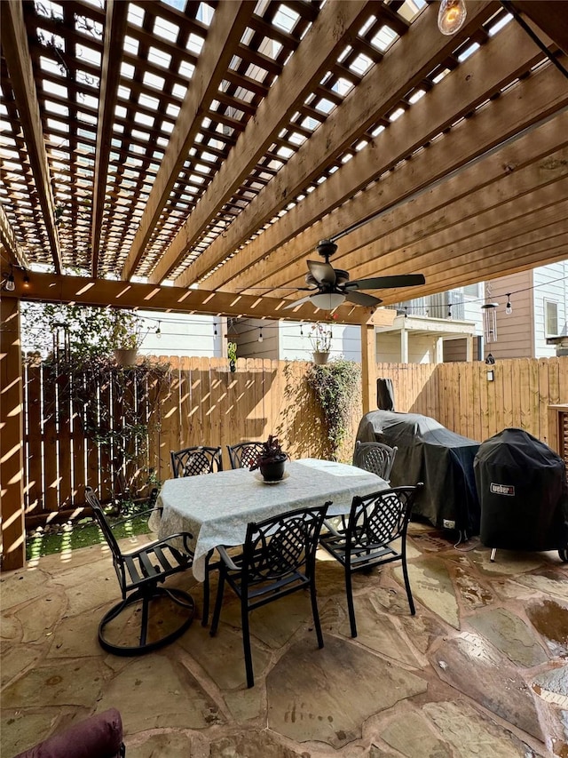 view of patio / terrace with outdoor dining space, area for grilling, fence, and a pergola