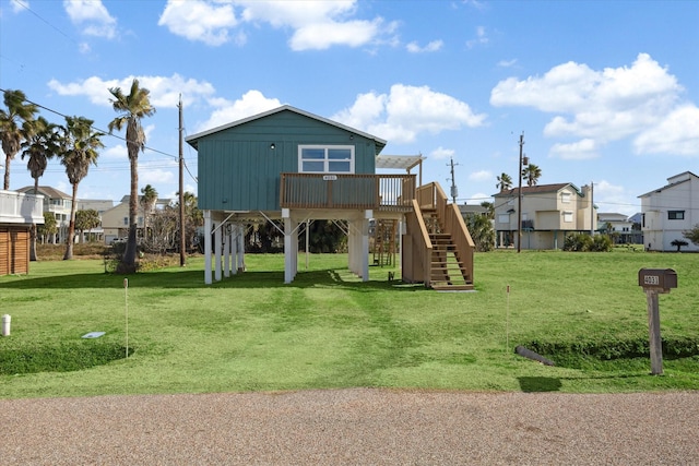 view of playground with a wooden deck and a yard