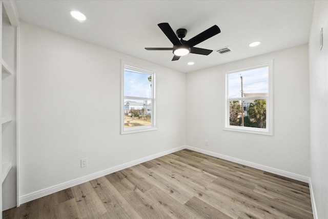 empty room featuring recessed lighting, ceiling fan, baseboards, and wood finished floors