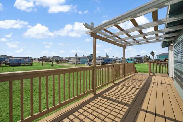 deck with a pergola and a yard