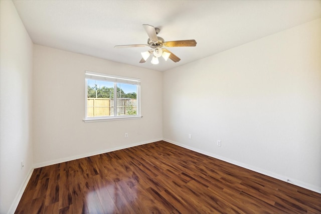 unfurnished room featuring ceiling fan and dark hardwood / wood-style floors