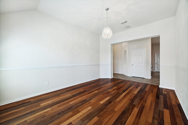 unfurnished room featuring dark hardwood / wood-style floors and a notable chandelier