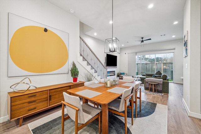 dining room featuring ceiling fan and light hardwood / wood-style flooring