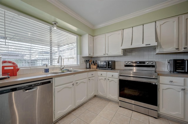 kitchen with stainless steel appliances, crown molding, sink, and white cabinets