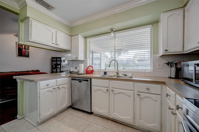 kitchen featuring sink, ornamental molding, kitchen peninsula, stainless steel appliances, and white cabinets