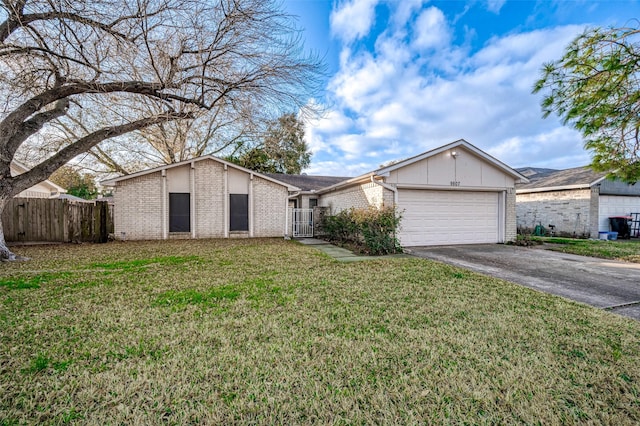 ranch-style house with a garage and a front lawn