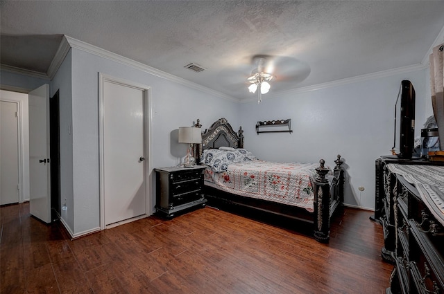 bedroom with ceiling fan, ornamental molding, dark hardwood / wood-style flooring, and a textured ceiling