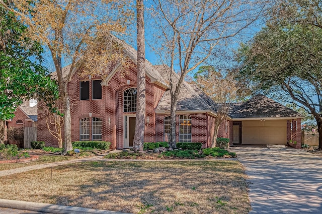 view of front of house with a garage and a front lawn