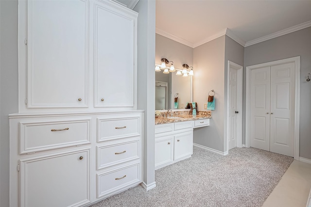 bathroom featuring ornamental molding and vanity