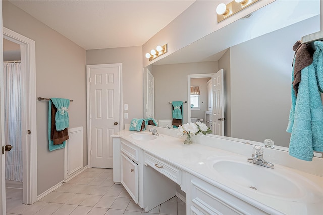 bathroom with vanity and tile patterned floors