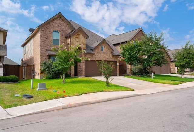 view of front of home featuring a garage and a front yard