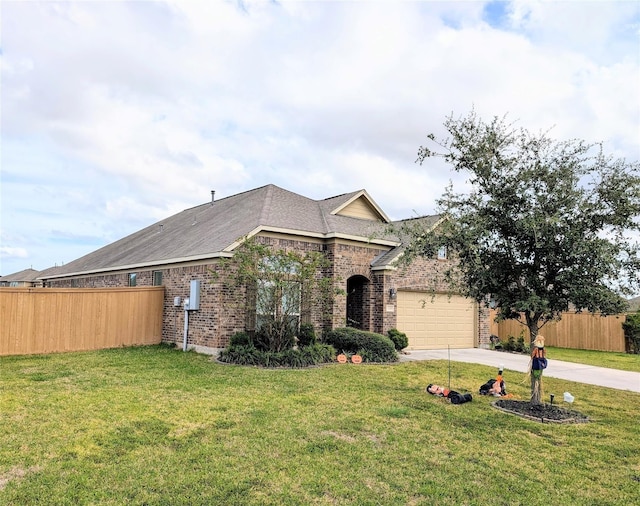 view of front of home with a garage and a front yard