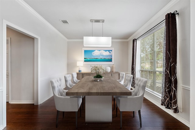 dining area featuring ornamental molding, dark wood finished floors, and visible vents