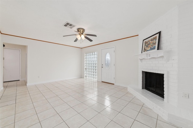 unfurnished living room featuring ornamental molding, light tile patterned floors, ceiling fan, and a fireplace