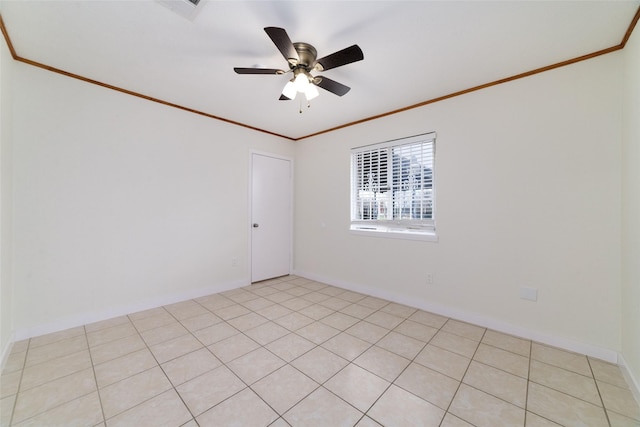 empty room featuring crown molding and ceiling fan