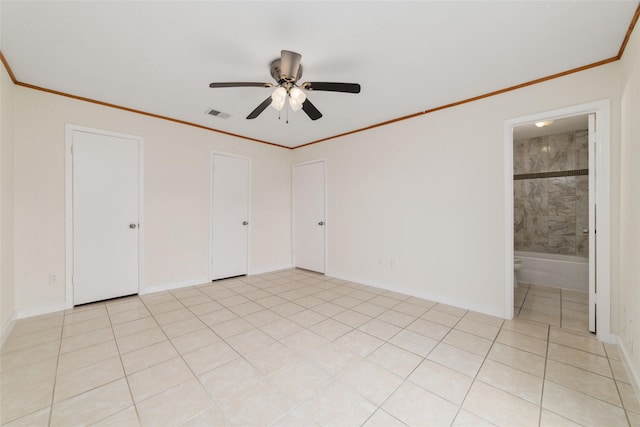 unfurnished bedroom featuring crown molding, ceiling fan, and light tile patterned floors