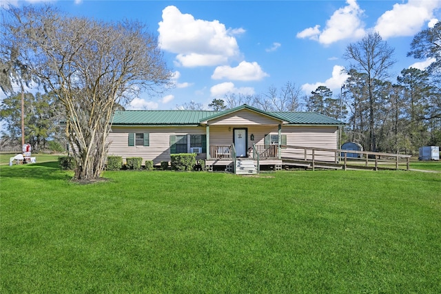 back of property featuring a yard