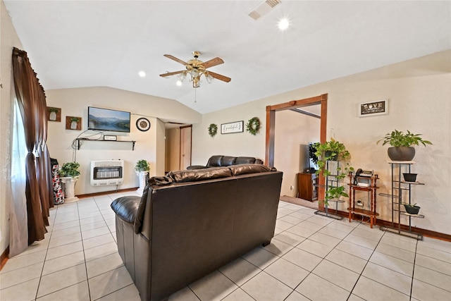 tiled living room featuring heating unit, vaulted ceiling, and ceiling fan