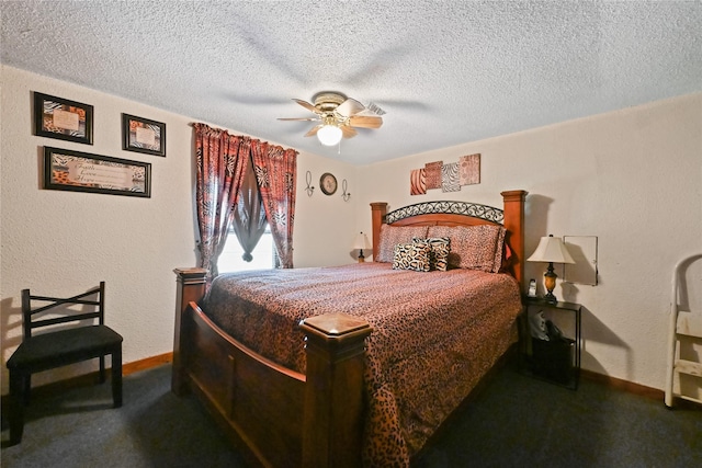 bedroom with ceiling fan, carpet floors, and a textured ceiling