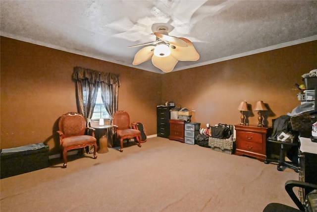 home office with crown molding, ceiling fan, and carpet