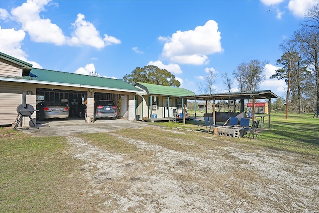 exterior space with a front yard and a carport