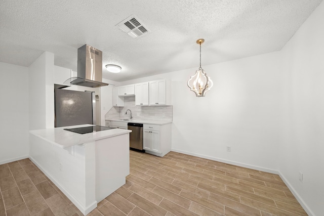 kitchen featuring appliances with stainless steel finishes, white cabinetry, decorative backsplash, island exhaust hood, and kitchen peninsula