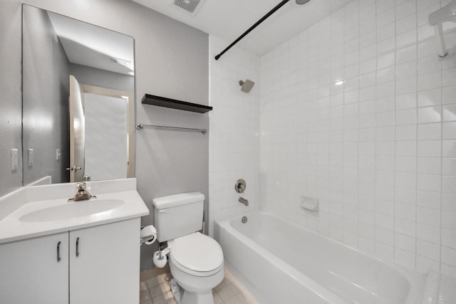 full bathroom with tiled shower / bath combo, vanity, and toilet