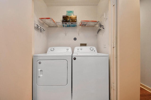 laundry area featuring hardwood / wood-style floors and independent washer and dryer