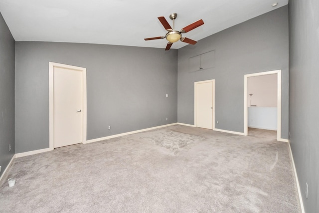 unfurnished bedroom with ceiling fan and light colored carpet