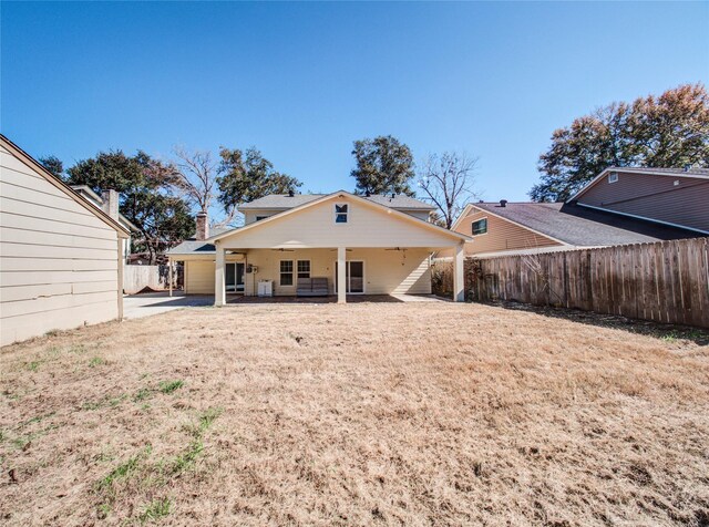 rear view of property featuring a patio